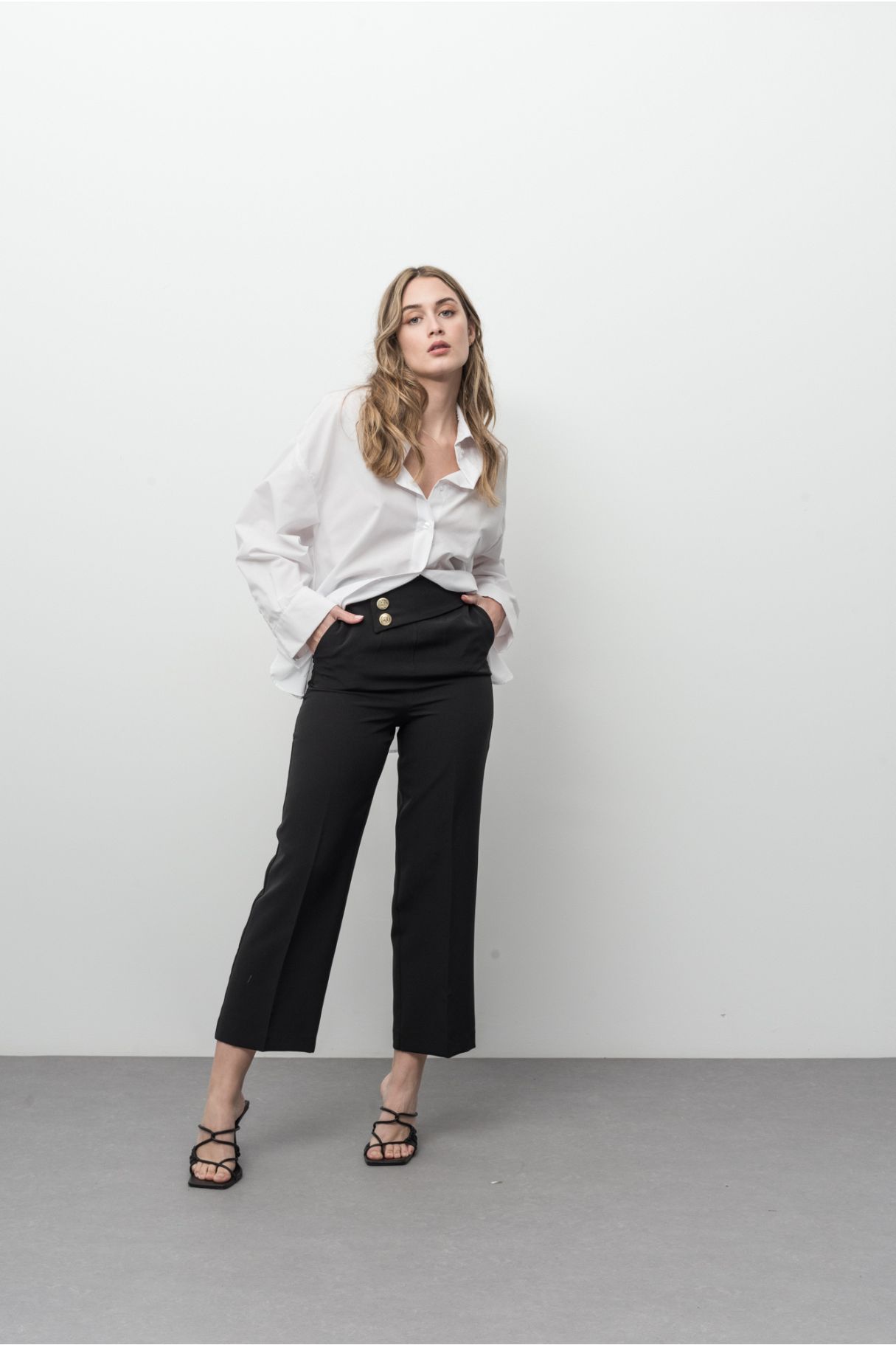 TROUSERS WITH GOLD-BUTTONED TAB